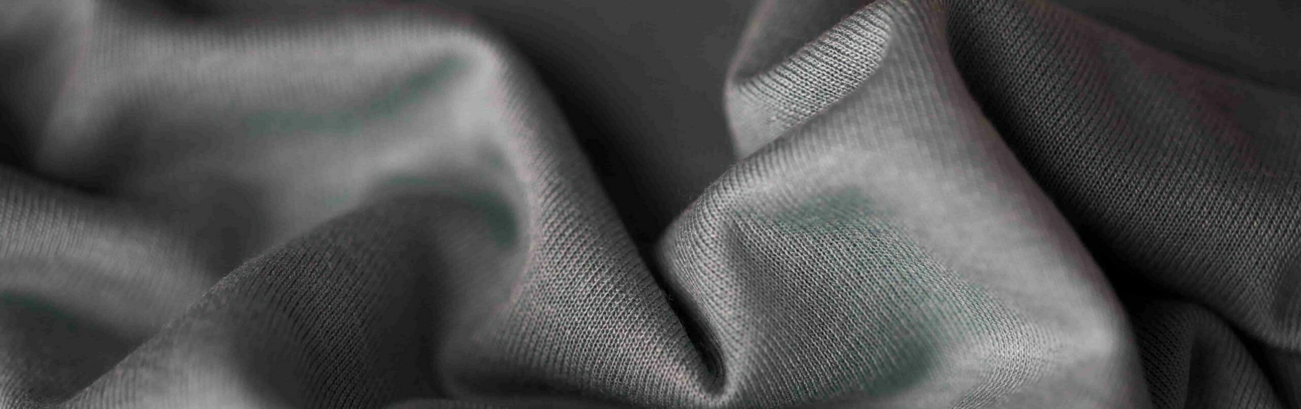 close-up de tecido cinza ou tecido escalado e1627543968252