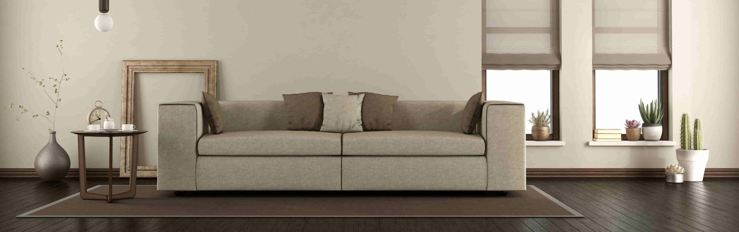 elegante salón con sofá sobre alfombra a escala e1627543817277